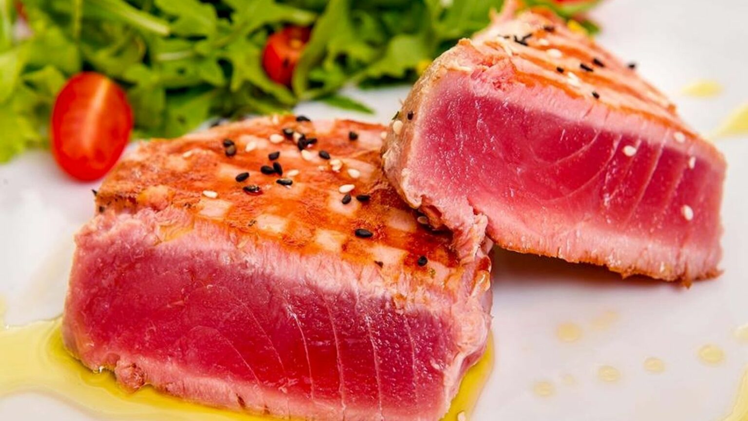 What temperature should tuna steaks be cooked to? JustALittleBite